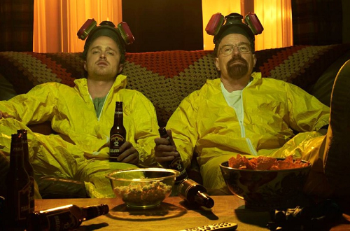 Jesse Pinkman and Walter White sit on a couch
