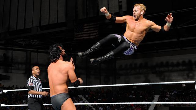Christian dropkicks Sandow