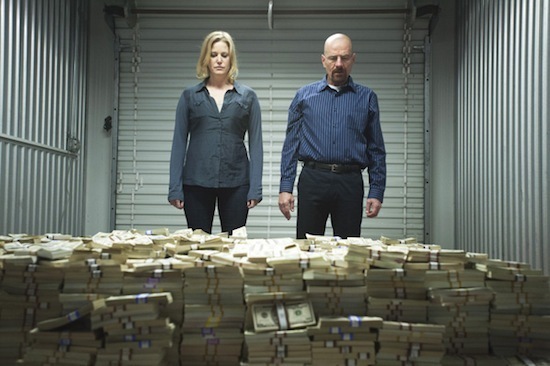 Skyler and Walt look at their pile of money on Breaking Bad