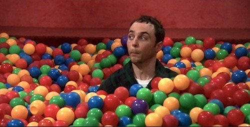 Sheldon surrounded by a bunch of plastic balls