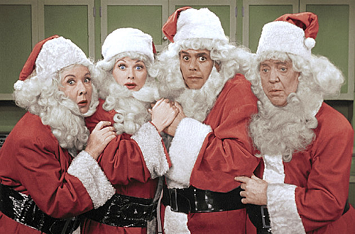 I Love Lucy cast wearing Santa costumes